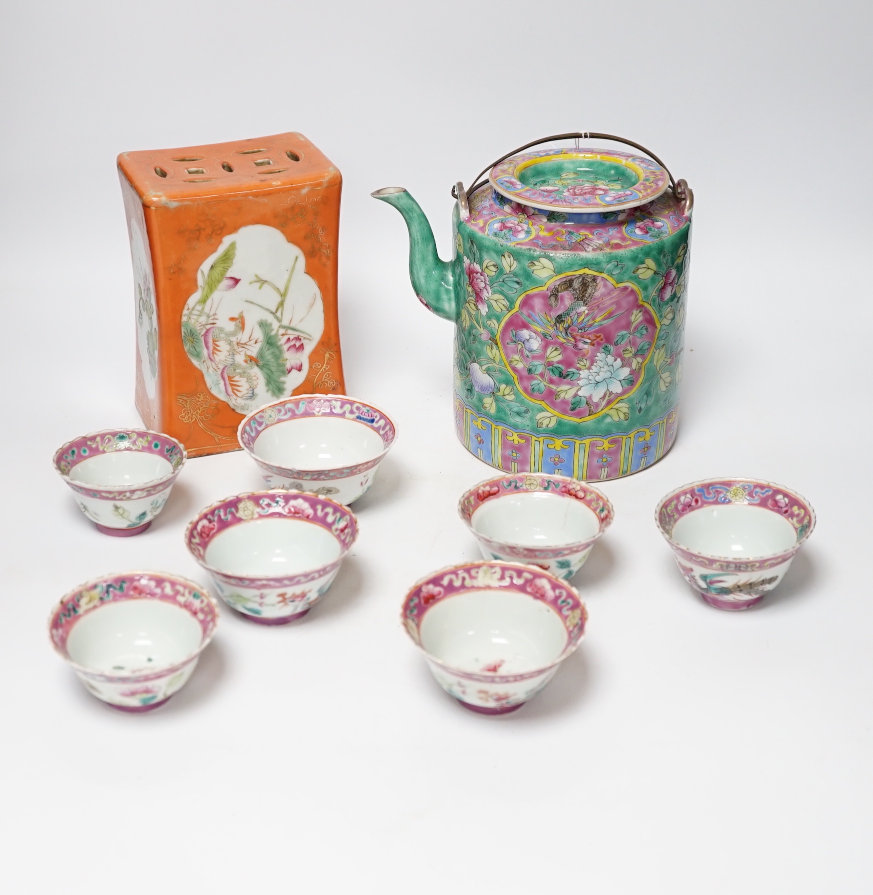 A Chinese Straits enamelled porcelain teapot and cover and seven similar tea bowls, Guangxu period and a pillow, teapot 18cm high including cover